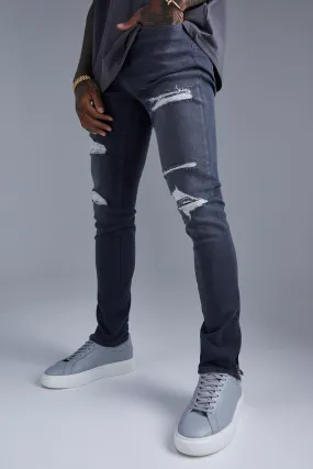 Skinny Stretch Ripped Jeans With Zip Hem